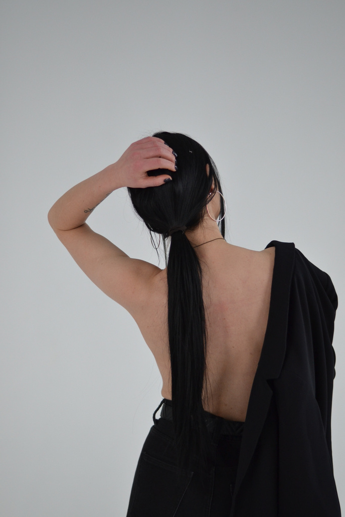Stylish minimalistic photo of a girl from the back